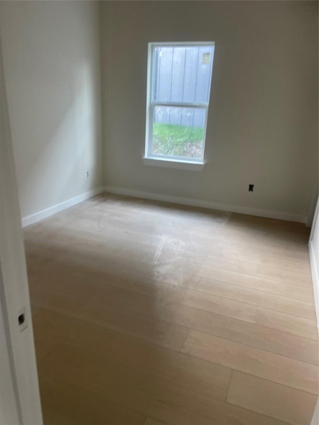 2510 Oxford Ave, Fort Worth, TX 76106 - empty room featuring baseboards and light wood-style flooring