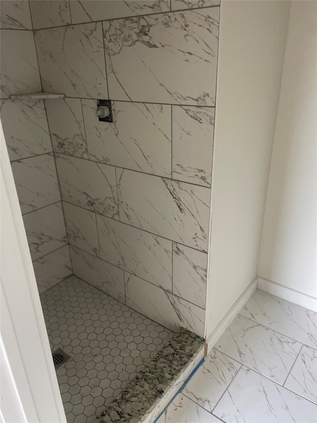 2510 Oxford Ave, Fort Worth, TX 76106 - bathroom featuring baseboards, marble finish floor, and a stall shower