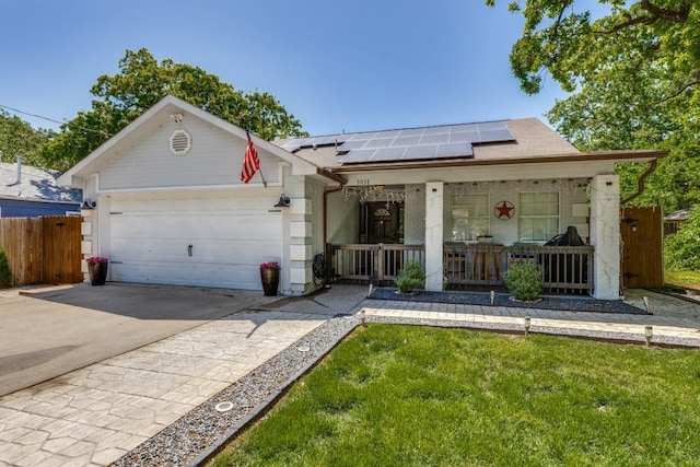 3031 Delaware Trl, Lake Worth, TX 76135 - view of front of home featuring covered porch, solar panels, an attached garage, concrete driveway, and a shingled roof