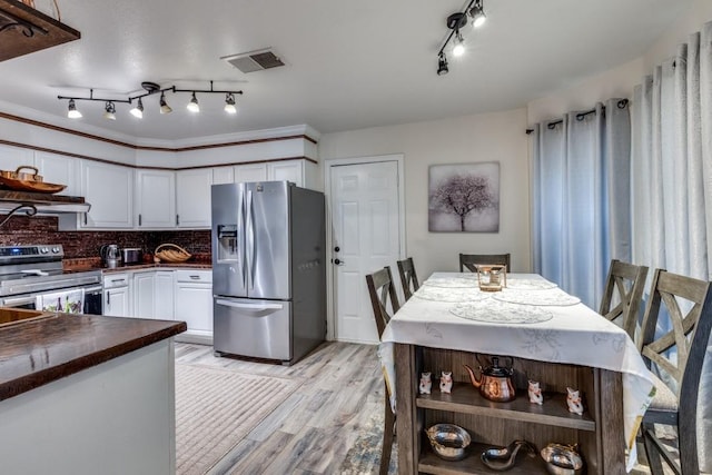 3031 Delaware Trl, Lake Worth, TX 76135 - kitchen with appliances with stainless steel finishes, open shelves, white cabinetry, light wood-style flooring, and backsplash