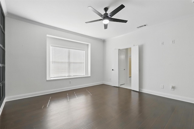 unfurnished room featuring a ceiling fan, visible vents, dark wood-style floors, and crown molding