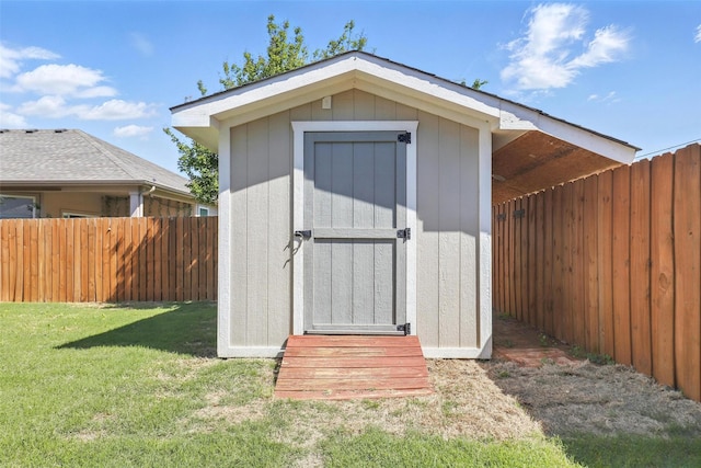 view of shed with fence