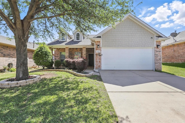 view of front of property featuring concrete driveway, brick siding, a front yard, and a garage