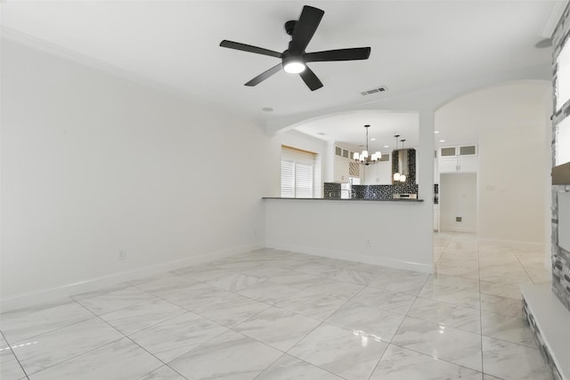 unfurnished living room featuring ceiling fan with notable chandelier, visible vents, arched walkways, and marble finish floor