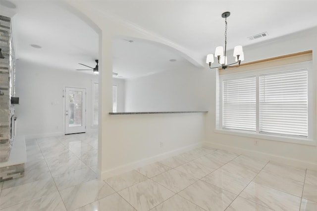 tiled empty room featuring baseboards, arched walkways, visible vents, and plenty of natural light