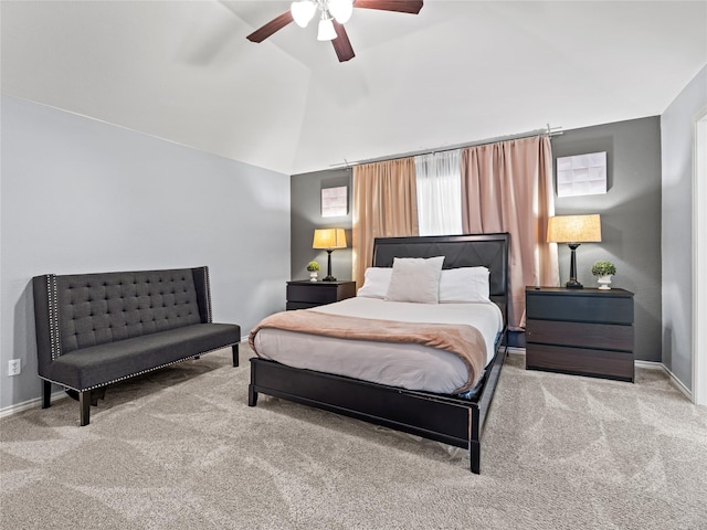 bedroom featuring carpet flooring, lofted ceiling, a ceiling fan, and baseboards