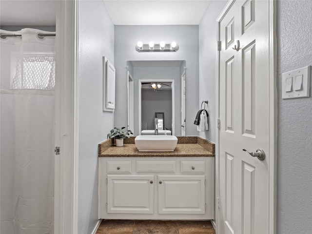 full bathroom featuring vanity and a shower with curtain