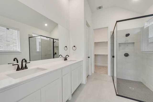 636 Caprice Blf, Fate, TX 75189 - full bath with vaulted ceiling, a shower stall, visible vents, and a sink