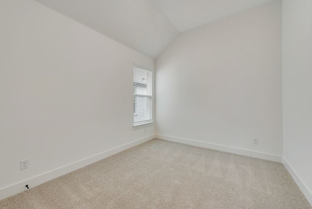 636 Caprice Blf, Fate, TX 75189 - empty room featuring lofted ceiling, baseboards, and light colored carpet