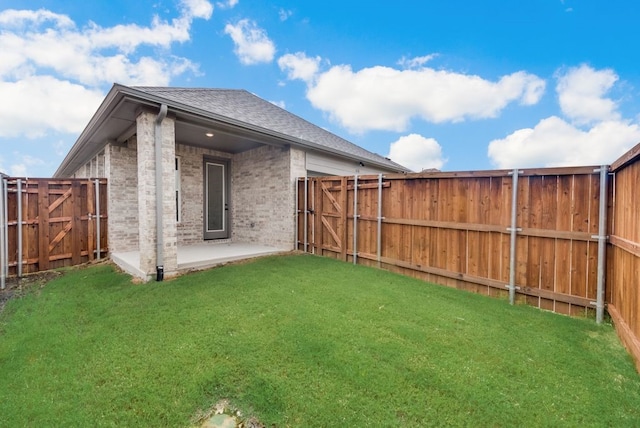 636 Caprice Blf, Fate, TX 75189 - rear view of house with a fenced backyard, a yard, roof with shingles, a patio area, and brick siding