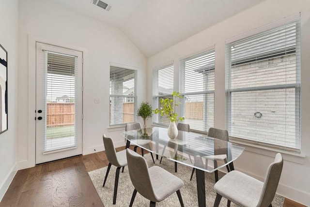 636 Caprice Blf, Fate, TX 75189 - dining space with vaulted ceiling, wood finished floors, visible vents, and baseboards