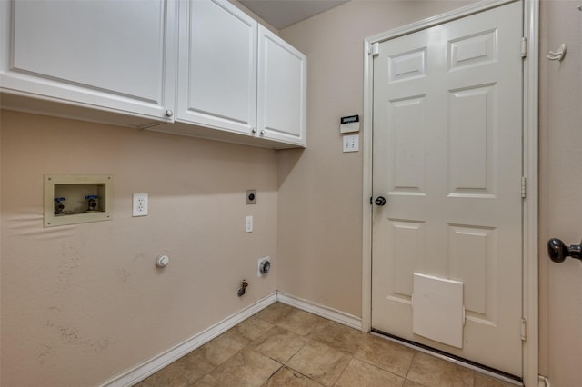 laundry area featuring hookup for an electric dryer, hookup for a washing machine, hookup for a gas dryer, baseboards, and cabinet space