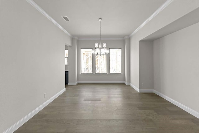 unfurnished dining area featuring a chandelier, wood finished floors, visible vents, and ornamental molding