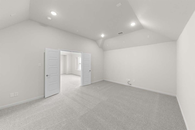 bonus room featuring lofted ceiling, light carpet, visible vents, and recessed lighting