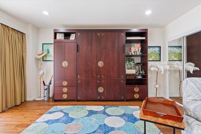 4924 Cobbs Dr Unit 3D, Waco, TX 76710 - living area featuring recessed lighting, wood finished floors, and baseboards