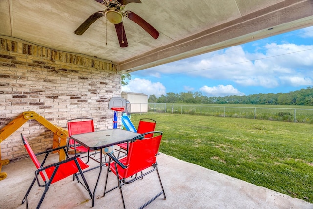 view of patio / terrace with a fenced backyard, ceiling fan, and outdoor dining space