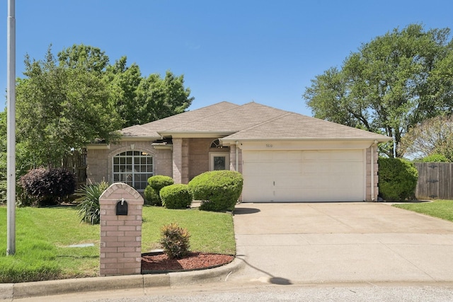 single story home with roof with shingles, a front lawn, driveway, fence, and an attached garage