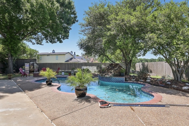 view of swimming pool featuring a patio area, a fenced backyard, and a fenced in pool