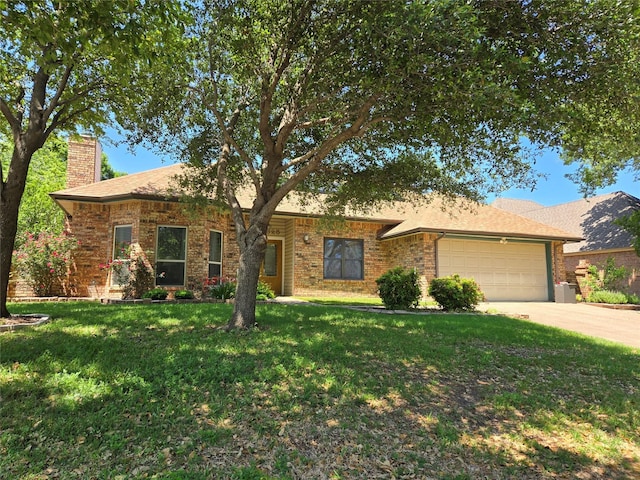 5625 Guadalajara Dr, North Richland Hills, TX 76180 - single story home with a chimney, a garage, a front lawn, driveway, and brick siding