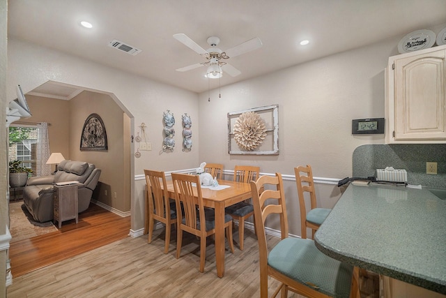 5625 Guadalajara Dr, North Richland Hills, TX 76180 - dining room with a ceiling fan, light wood finished floors, baseboards, recessed lighting, and arched walkways