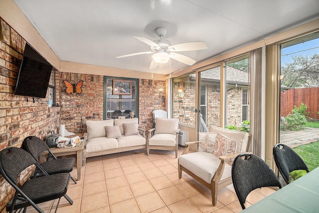 5625 Guadalajara Dr, North Richland Hills, TX 76180 - sunroom featuring brick wall, tile patterned floors, a ceiling fan, and outdoor lounge area