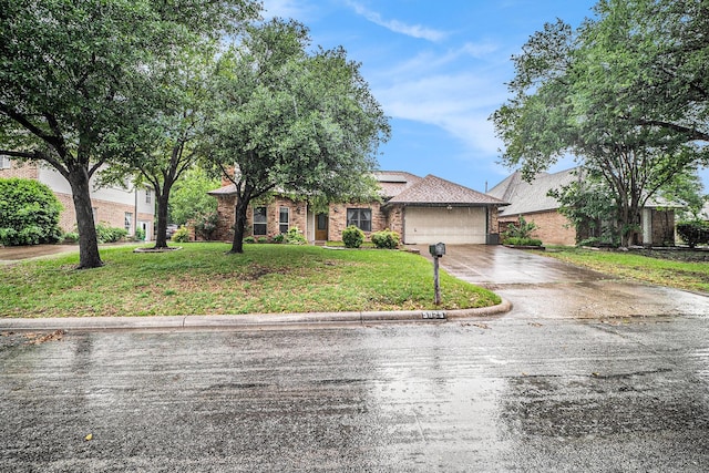 5625 Guadalajara Dr, North Richland Hills, TX 76180 - view of front of home with concrete driveway, a garage, a front yard, and brick siding