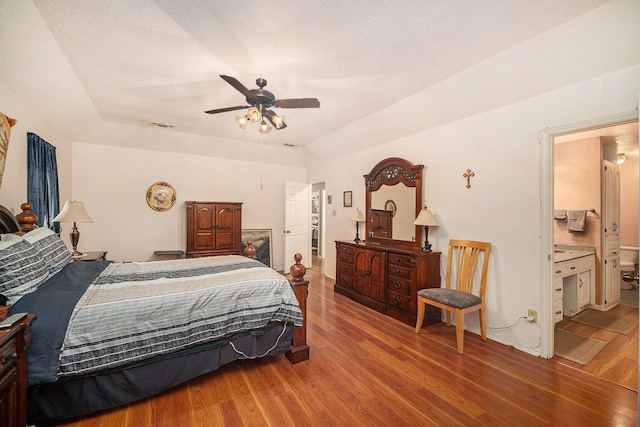 5625 Guadalajara Dr, North Richland Hills, TX 76180 - bedroom featuring wood finished floors, ensuite bathroom, and a ceiling fan