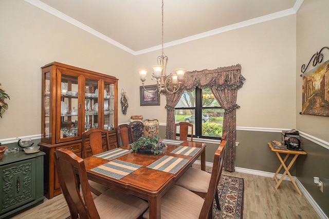 5625 Guadalajara Dr, North Richland Hills, TX 76180 - dining space with a chandelier, light wood finished floors, ornamental molding, and baseboards