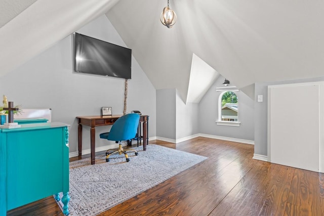 office featuring vaulted ceiling, wood finished floors, and baseboards