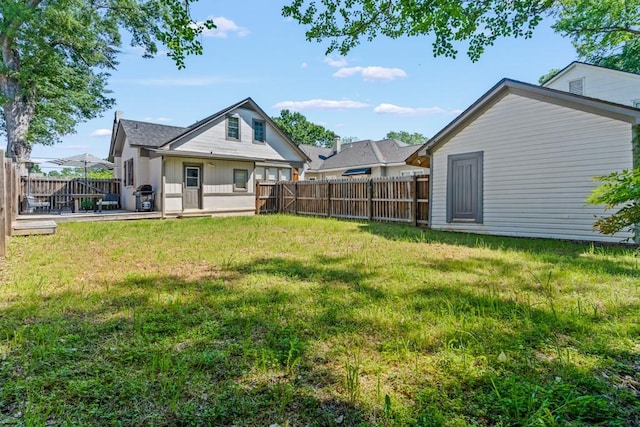 view of yard with a fenced backyard