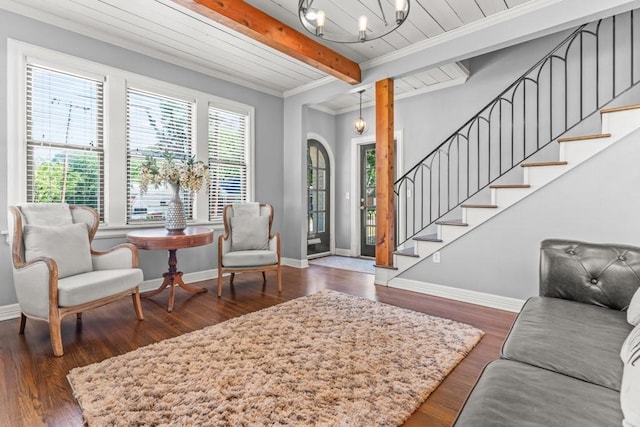 interior space featuring a notable chandelier, wood finished floors, stairs, and beamed ceiling