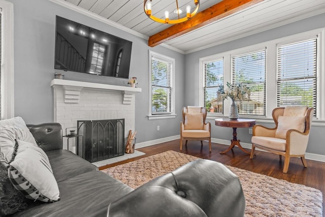 living area featuring wood finished floors, baseboards, and a notable chandelier