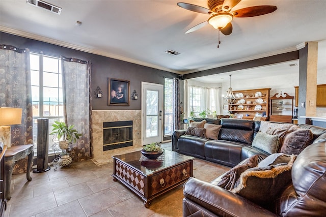 3932 Harrison Ct, Carrollton, TX 75010 - tiled living area with ornamental molding, visible vents, and ceiling fan with notable chandelier