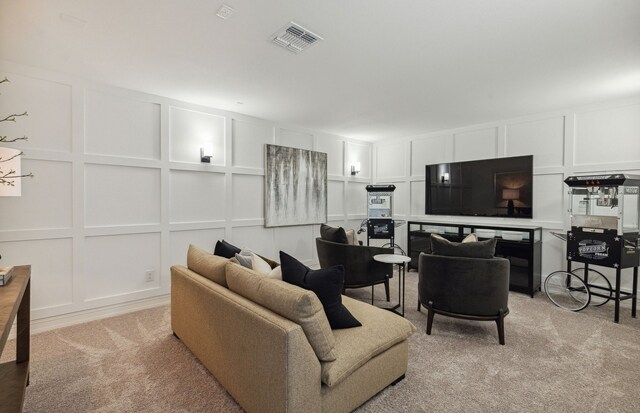 5939 Mayer Ave, Pilot Point, TX 75009 - living area featuring light carpet, visible vents, and a decorative wall