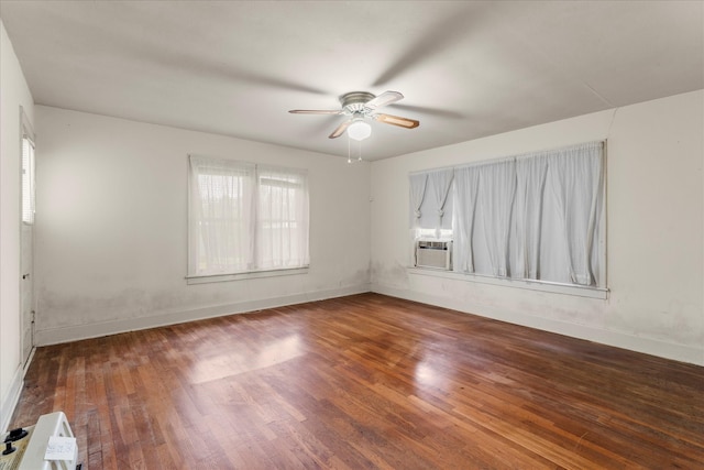 1302 E 1st St, Mount Pleasant, TX 75455 - empty room with cooling unit, wood finished floors, baseboards, and ceiling fan