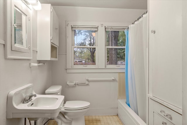 1302 E 1st St, Mount Pleasant, TX 75455 - bathroom featuring toilet, tile patterned floors, and a sink