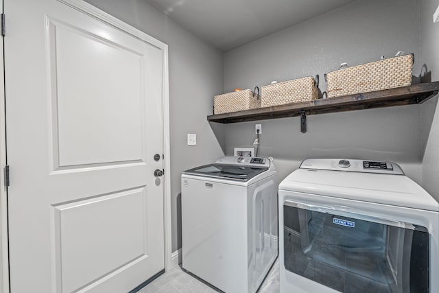 5003 Frio Dr, Granbury, TX 76048 - laundry room with independent washer and dryer and light tile patterned floors