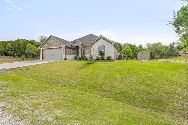 5003 Frio Dr, Granbury, TX 76048 - view of front of property with driveway, central air condition unit, a front yard, an attached garage, and stone siding