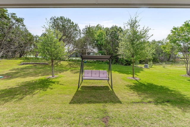 5003 Frio Dr, Granbury, TX 76048 - view of grassy yard featuring view of wooded area