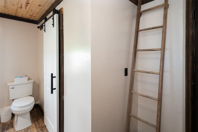 bathroom featuring wooden ceiling, wood finished floors, and toilet