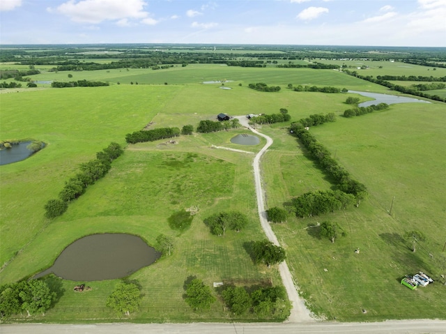 aerial view featuring a water view and a rural view