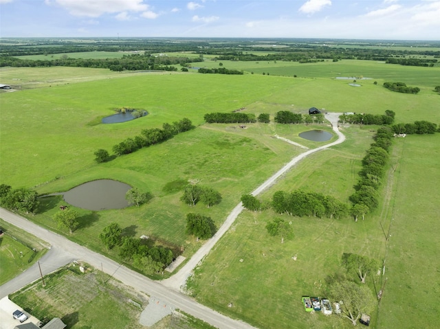 bird's eye view featuring a rural view and a water view