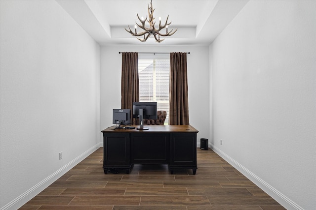 12816 Rocky Top Rd, Godley, TX 76044 - office area featuring baseboards, an inviting chandelier, a raised ceiling, and dark wood-style flooring