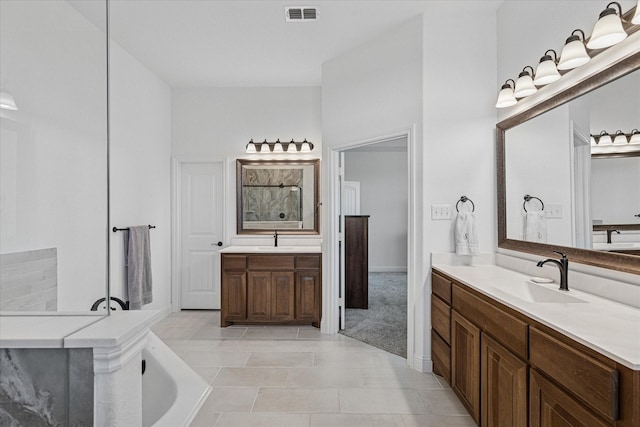 12816 Rocky Top Rd, Godley, TX 76044 - bathroom featuring two vanities, walk in shower, visible vents, and a sink