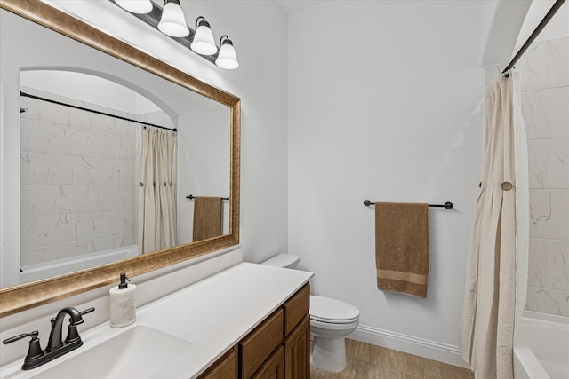 12816 Rocky Top Rd, Godley, TX 76044 - full bathroom with toilet, wood finished floors, vanity, shower / tub combo, and baseboards