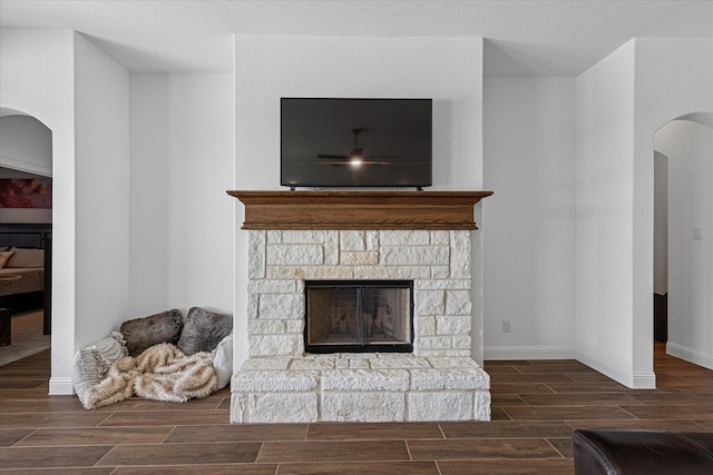 12816 Rocky Top Rd, Godley, TX 76044 - details featuring baseboards, a fireplace, wood tiled floor, and arched walkways