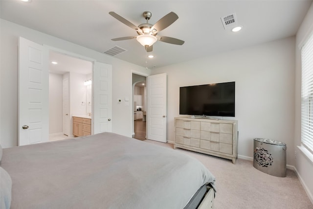 bedroom featuring arched walkways, visible vents, and recessed lighting