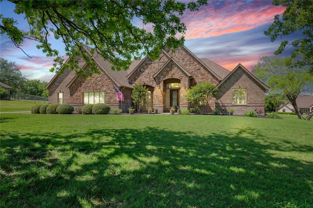 100 Meadow Arbor Dr, Weatherford, TX 76085 - view of front facade with stone siding, a yard, and brick siding