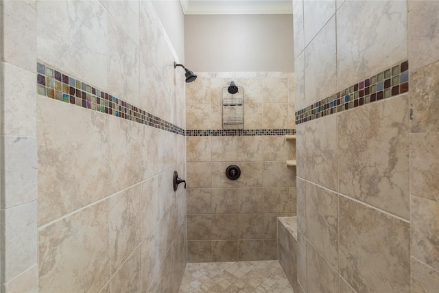 full bath with two vanities, a tub with jets, ornamental molding, and a sink