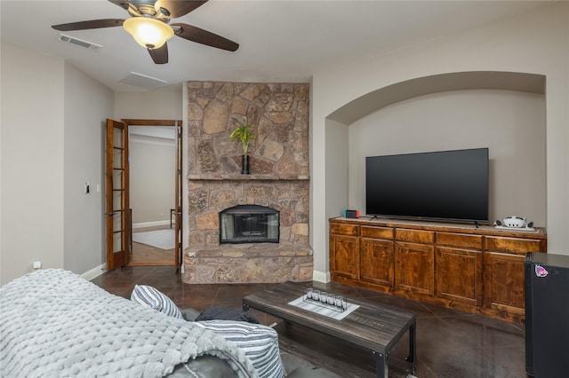 100 Meadow Arbor Dr, Weatherford, TX 76085 - living room with a ceiling fan, a fireplace, baseboards, and dark tile patterned floors